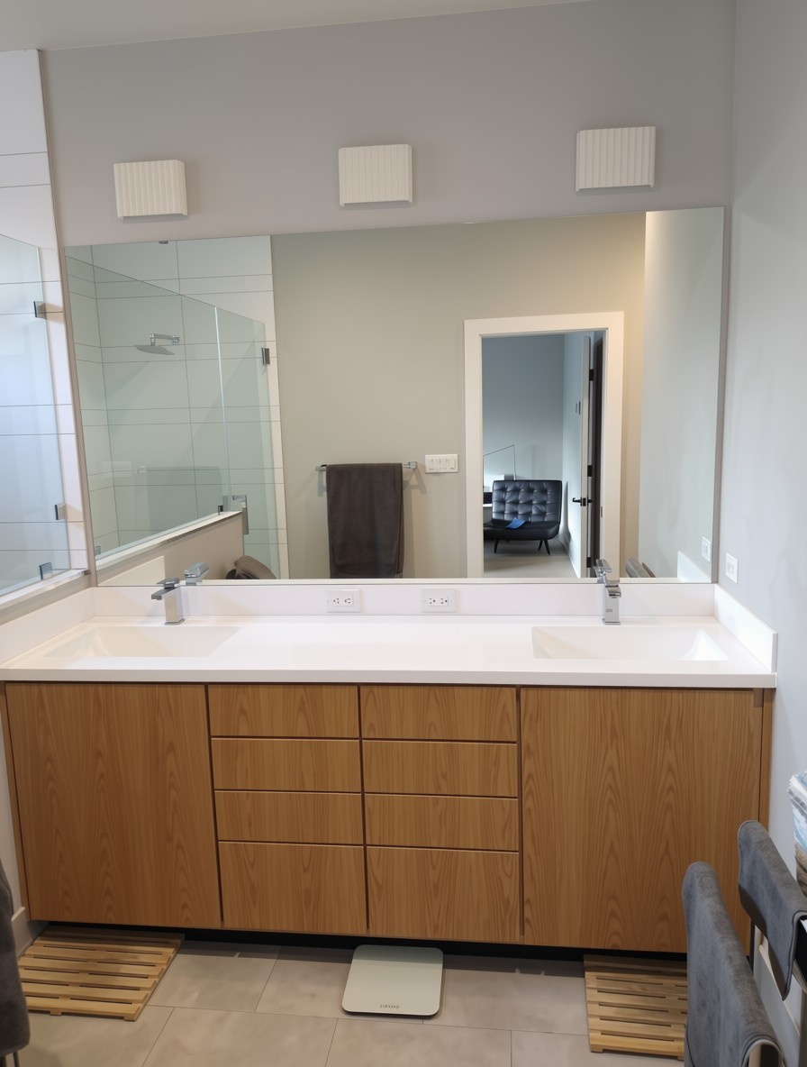 Double bathroom vanity with warm wood cabinetry